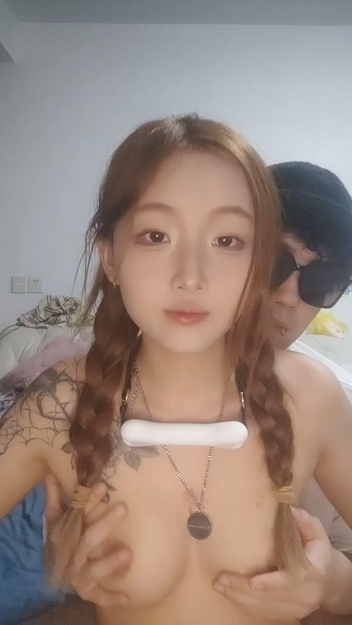 A stunningly beautiful 19-year-old college girl, with contrasting tattoos,